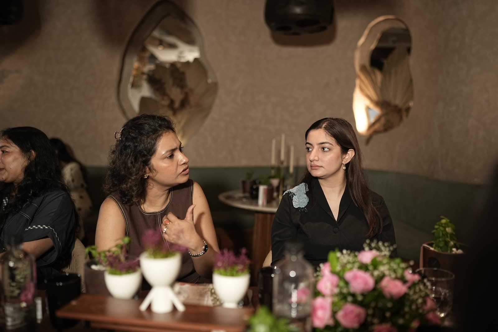 Two members listening during a Commons session.